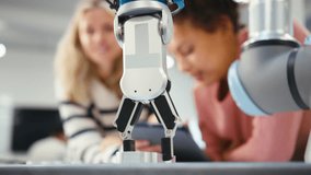 Two Female College Or University Engineering Students Using Digital Tablet To Control Robot Arm - Powered by Shutterstock - Get 15% off with code: PIKWIZARD15