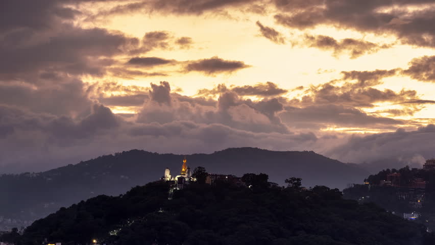 Ending day 4K sunset time lapse of incredible clouds moving waves over Swayambhunath tample in Kathmandu, Nepal. Beauty in Nature, traveling, buddhism culture, architekture concept 4K video.
