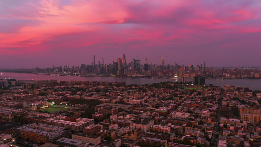 Establishing Aerial View Shot of New York City NY, NYC, United States, pink sunset magic, breathtaking view, Flatiron Building, Empire State Building, Rockefeller Center, Times Square, Hudson Yards Royalty-Free Stock Footage #1111483463