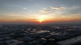 A bird's-eye view video from a drone shows the industrial site as the sun is about to set.