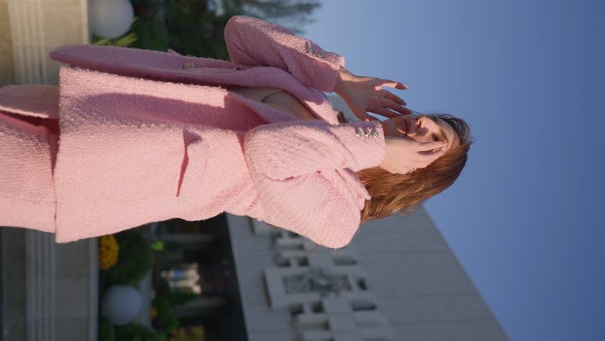 Beautiful Business Woman in a Pink Jacket and Dress Posing a City Street. Vertical Video, Slow Motion. | Shutterstock HD Video #1111488885