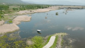 Aerial clips filmed at Lake Kerkini - Mount Beles in Northern Greece (Village Mandraki). Video clips demonstrating the beauty of the lake with swamp, marsh and the vegetation at the specific area