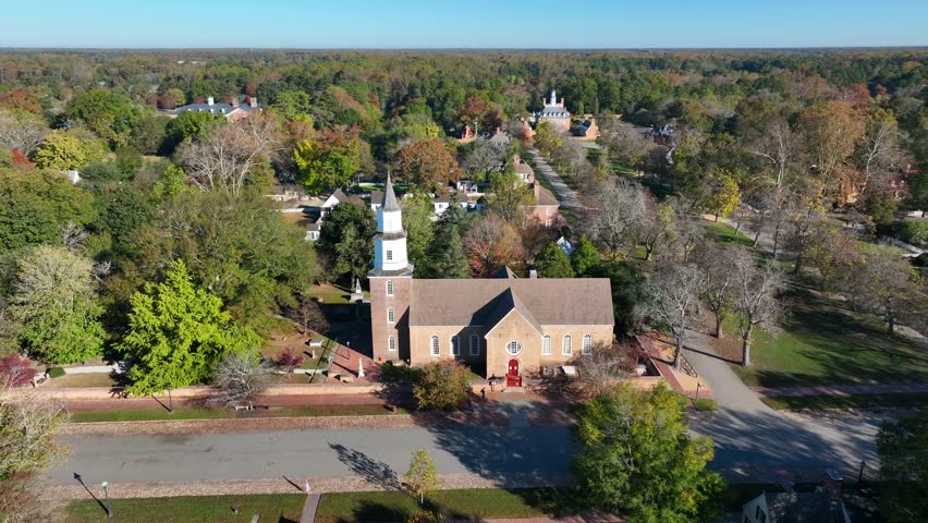 Colonial Williamsburg church: Bruton Parish Episcopal Church. Aerial shot of historic town in autumn.