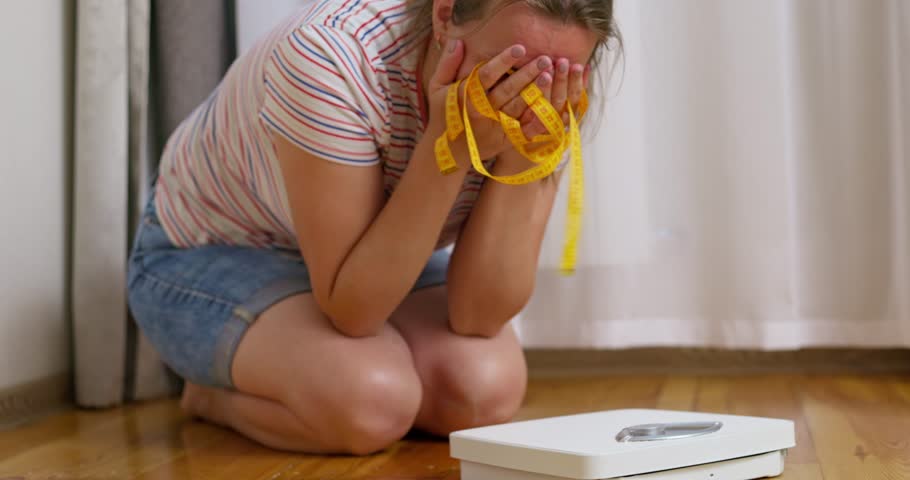 Libra and depressed, frustrated and sad woman crying while sitting on the floor