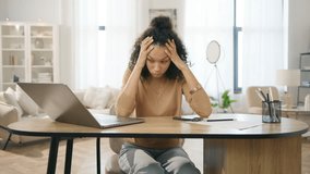 Sad tired woman overworked on computer. Unhappy frustrated businesswoman working remotely at home office. Tired diverse model workaholic annoyed, overwhelmed, exhausted, stressed by deadlines 4k - Powered by Shutterstock - Get 15% off with code: PIKWIZARD15