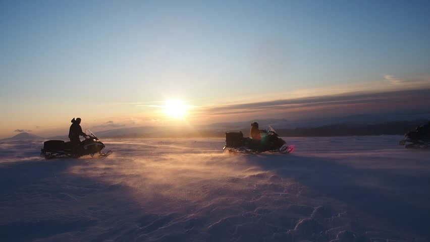 Snowmobiling in the Arctic. exciting winter sports and recreation, sunset winter landscape, blizzard, snow storm. extreme snowmobiling tours, winter travel adventure, cold weather | Shutterstock HD Video #1111514009