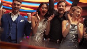 Cinematic Portrait of a Group of Excited Casino Goers Enjoying Time in a Modern Gambling Club with Friends. Diverse People Playing, Placing Bets and Winning in a Roulette. Slow Motion Footage - Powered by Shutterstock - Get 15% off with code: PIKWIZARD15