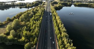 Transportation and roads. Aerial view. The road through the woods. Video background. Industrial landscape from a drone. View from above.