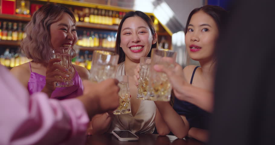 Beautiful Asian Woman Enjoying with Friend in Bar. They Drinking Cocktail Together in Bar Counter. Party, Lifestyle, Happiness, Cheerful and Celebration Concept. | Shutterstock HD Video #1111527601