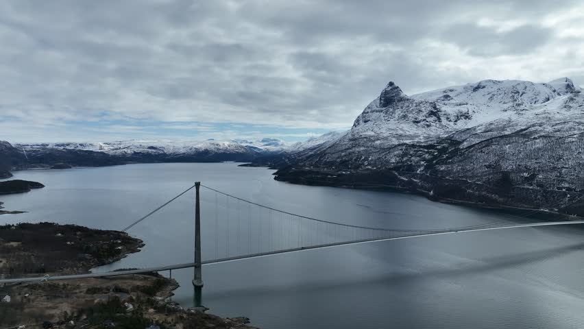 Aerial View Of a bridge With Snowy Fields And Mountains In Narvik, Norway