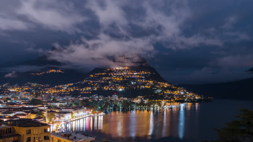 Lugano, Switzerland on Lake Lugano from night till dawn.