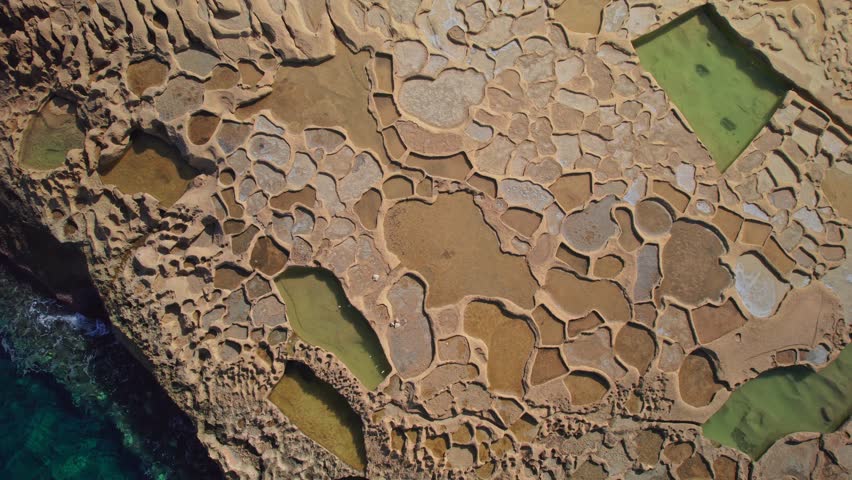 Dynamic Aerial Over Salt Pans on Coast of Gozo Island, Malta