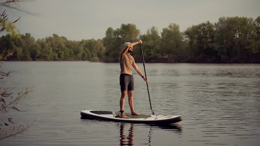 Paddleboarder Sport Sup Surfing. Recreation Paddling Sup Surfboard. Inflatable Board Rowing. Surfer Recreation Sport Watersport Activity.Travelling Water Tourism.Raft SUP. Paddler Surfing Exploration Royalty-Free Stock Footage #1111534567