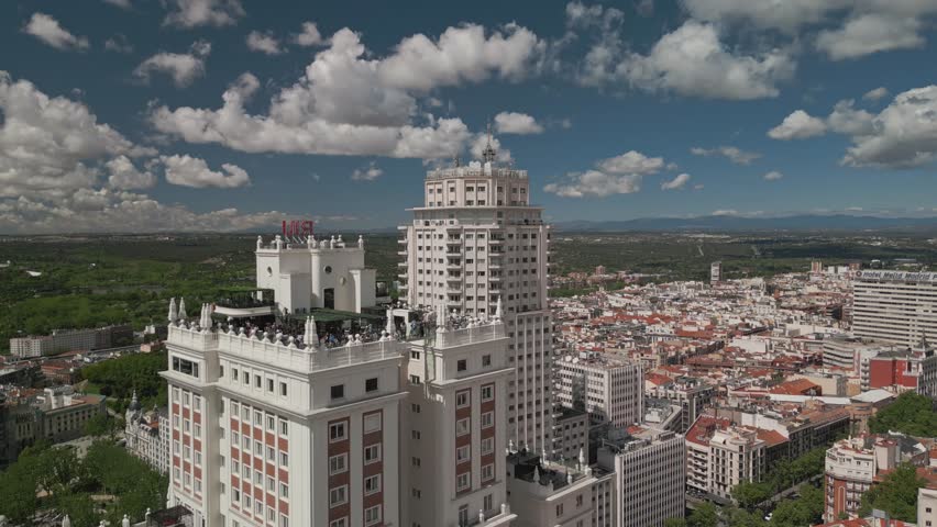 Establishing aerial view of Madrid Gran Via buildings architecture and cars driving on a beautiful sunny day, Madrid Spain tourism attractions Royalty-Free Stock Footage #1111535055