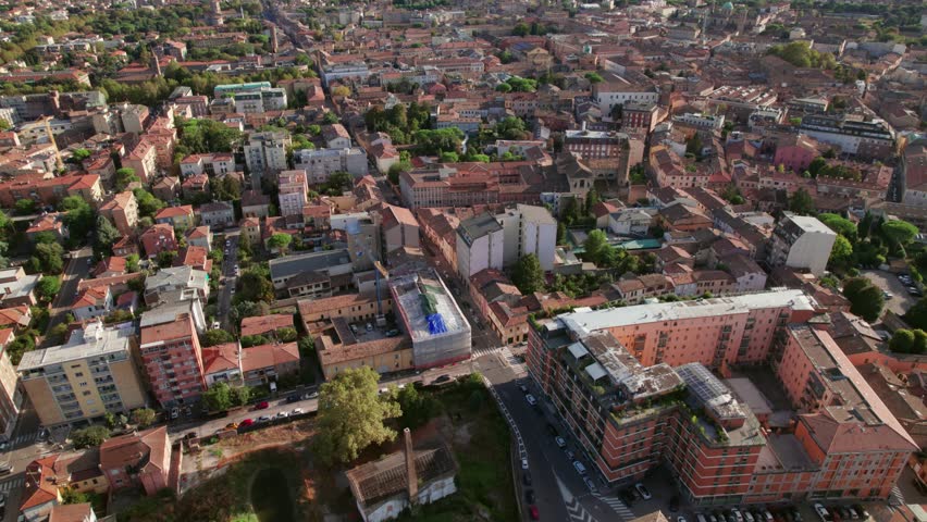 Ravenna, Italy, drone push in, tilt-up view of urban architecture