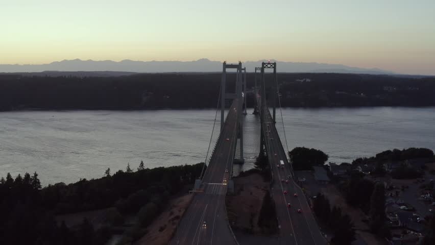 Fly Over Tacoma Narrows Bridge During Sunrise In Pierce County, Washington, United States. Aerial Shot