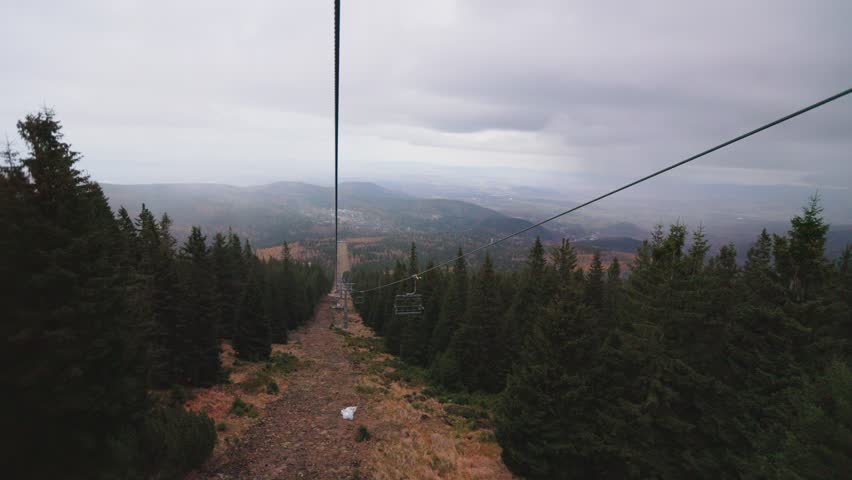 Cable transport, cable car going down the mountain, cloudy weather, Karpacz, Poland