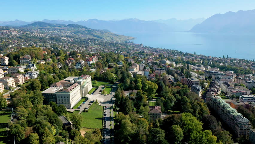 Overfly Lausanne City Towards The East Of Vaud Canton In Lake Geneva, Switzerland. Aerial Drone Shot