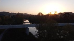 View of the Besaya river in Torrelavega with aerial drone view, in a summer sunset 
