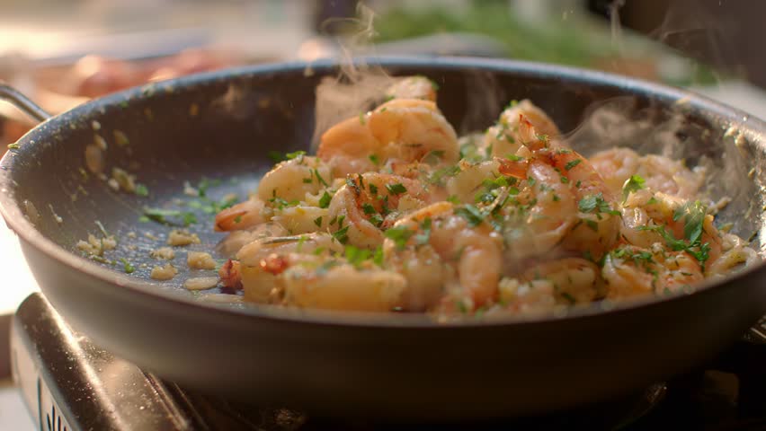 Fresh Shrimp Cooking in a Steaming Skillet on Stove