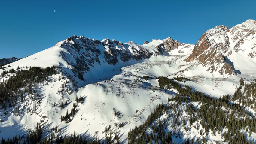 Aerial shot of the snow covered Rocky Mountains in Colorado.