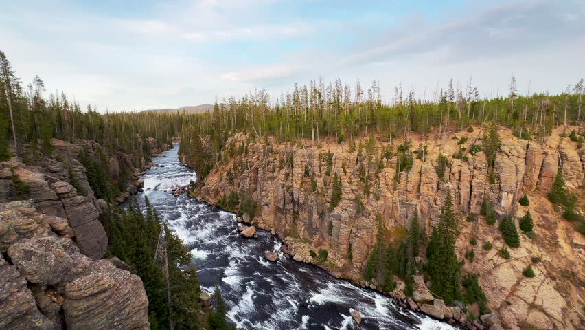 South Yellowstone Teton Grand National Park Lewis Fall waterfall entrance late afternoon sunset stunning Yellowstone river lookout point beautiful fall autumn October pan left slowly movement