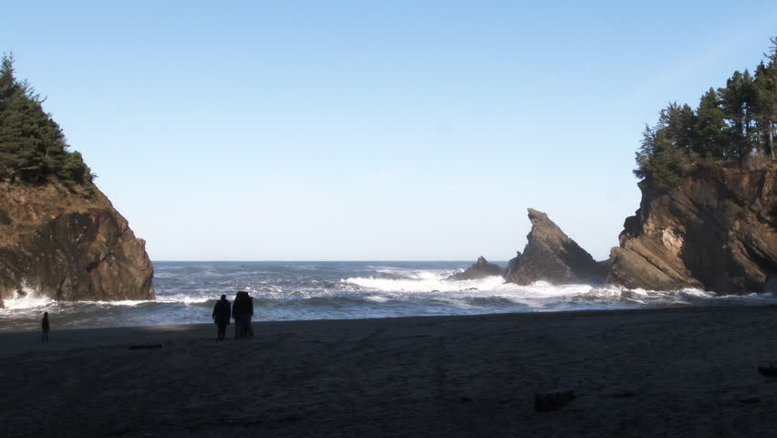 Unrecognizable family enjoy a secret beach off the beaten path at a hidden cove on the Oregon Coast. | Shutterstock HD Video #1111550605