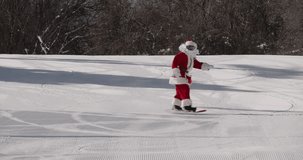 Snowboarder in Santa Claus suit carving on the ski slope. Winter sports, festive holiday mood - Powered by Shutterstock - Get 15% off with code: PIKWIZARD15