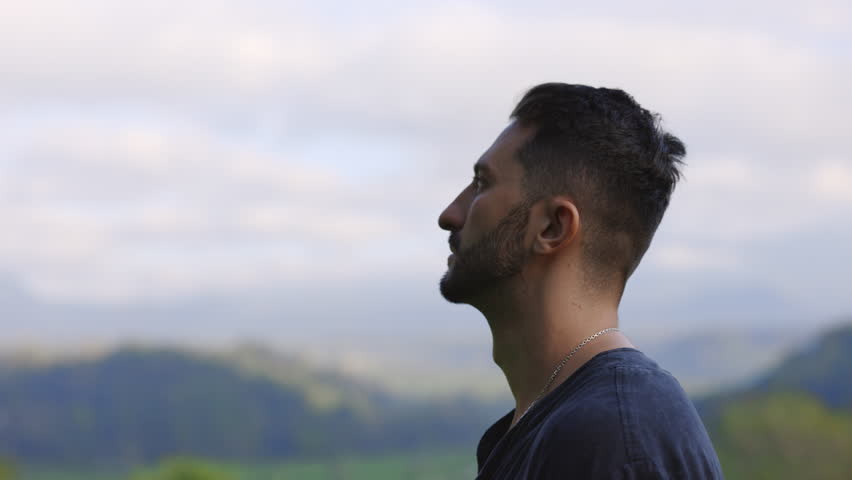 Side View of the Bearded Multiracial Man Standing Outdoors, Looking Away, Dreaming. Handsome Tourist Posing in the Mountains Background. People Concept | Shutterstock HD Video #1111559687
