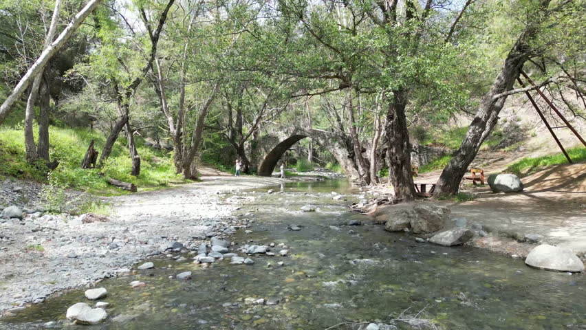 Aerial view of the nature of Cyprus. A beautiful mountain river flows down the stones. High quality 4k footage