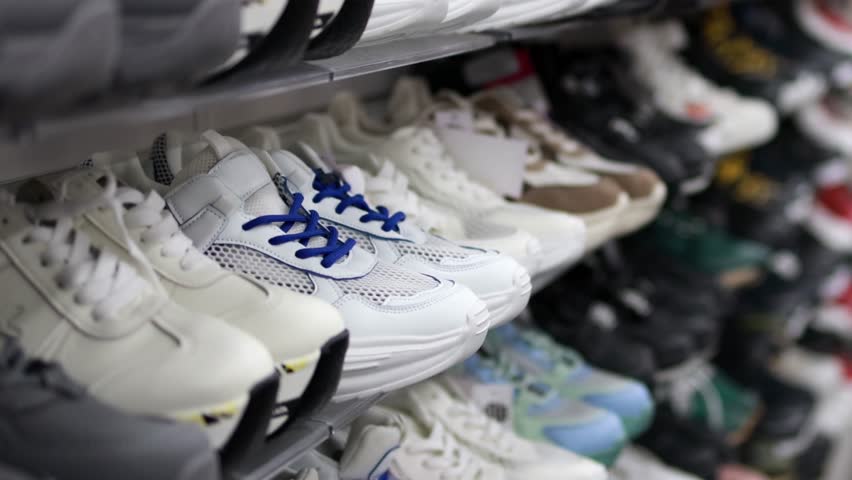 Shelves with sneakers in a store.