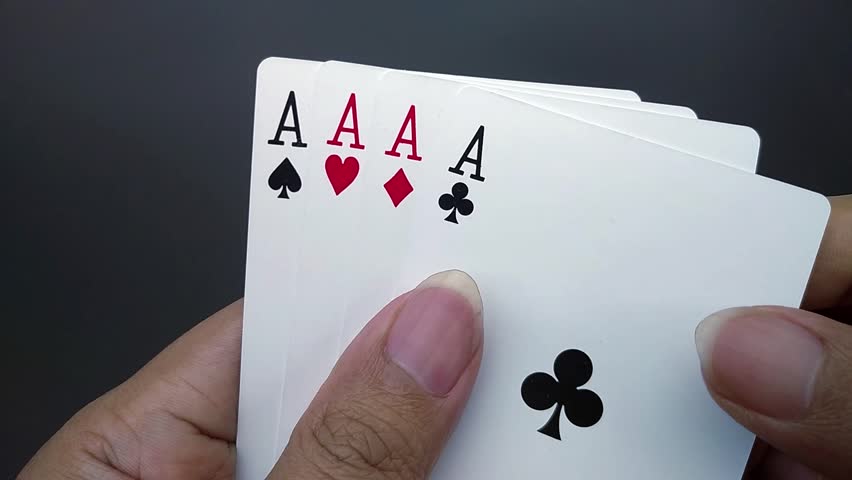 Players hold four aces and then face down the aces or poker playing cards