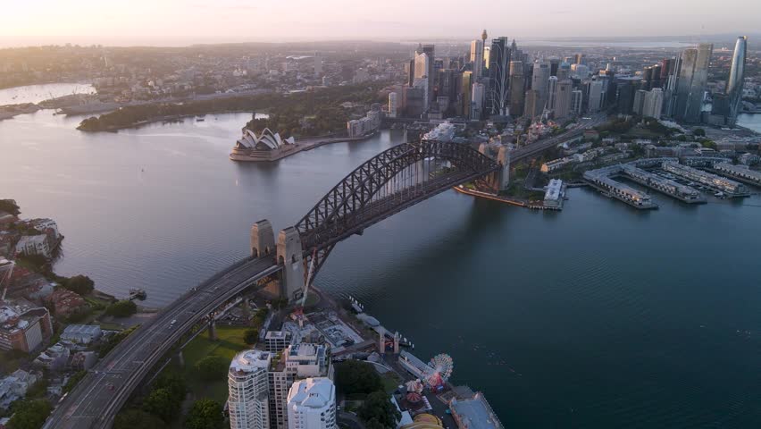 Aerial drone view of Sydney City, the Sydney Harbour and Harbour Bridge, NSW Australia on a sunny early morning in November 2023 