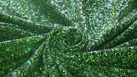 Luminous green sequin fabric twisted into a spiral, with a shimmering surface reflecting light, creating a vibrant 3D animation effect. - Powered by Shutterstock - Get 15% off with code: PIKWIZARD15