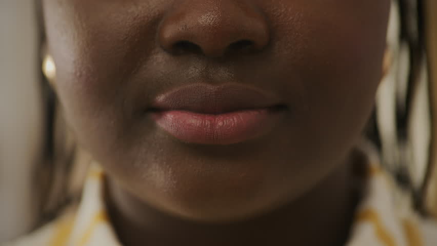 Black Female Mouth Smiling Close Up. African woman smiling at camera. Half female face.  | Shutterstock HD Video #1111571935