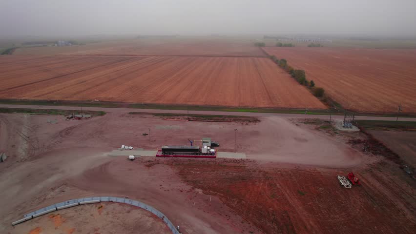 The grain truck is weighing on a scale after got loaded with grain from a temporary granary storage. Moody day, Chapman, NE, USA
