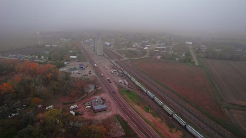 Misty autumn view of cereal silos and storage facilities. Moody day, Chapman, NE, USA
