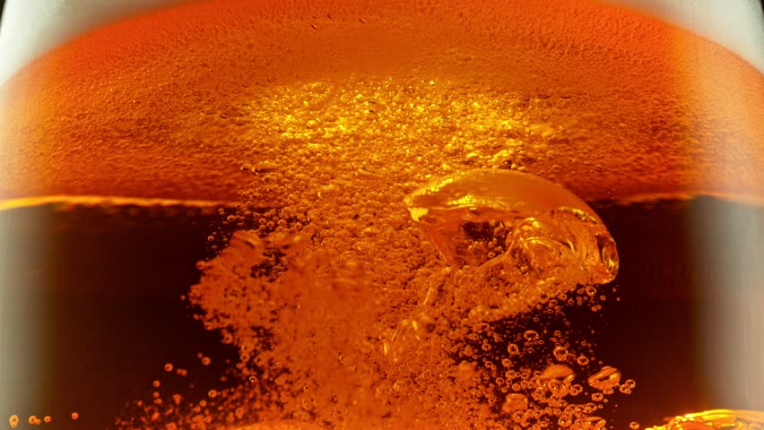 Super Slow Motion Detail Shot of Bubbling and Swirling Fresh Beer in Glass at 1000fps. | Shutterstock HD Video #1111575371