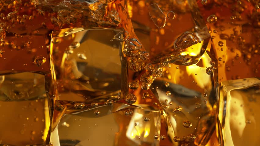 Super Slow Motion Detail Shot of Bubbling Lemonade and Perfect Clear Ice Cubes at 1000fps. | Shutterstock HD Video #1111575391