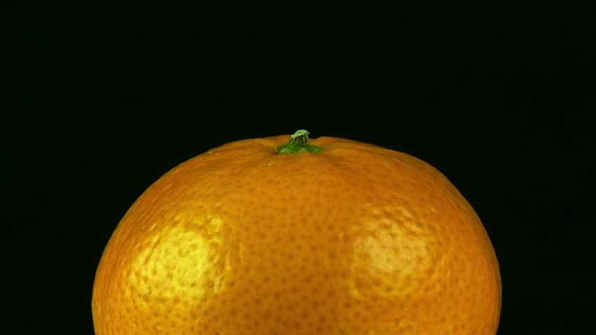Extreme isolated fruit close up: Clementine orange revolves on black - Powered by Shutterstock - Get 15% off with code: PIKWIZARD15