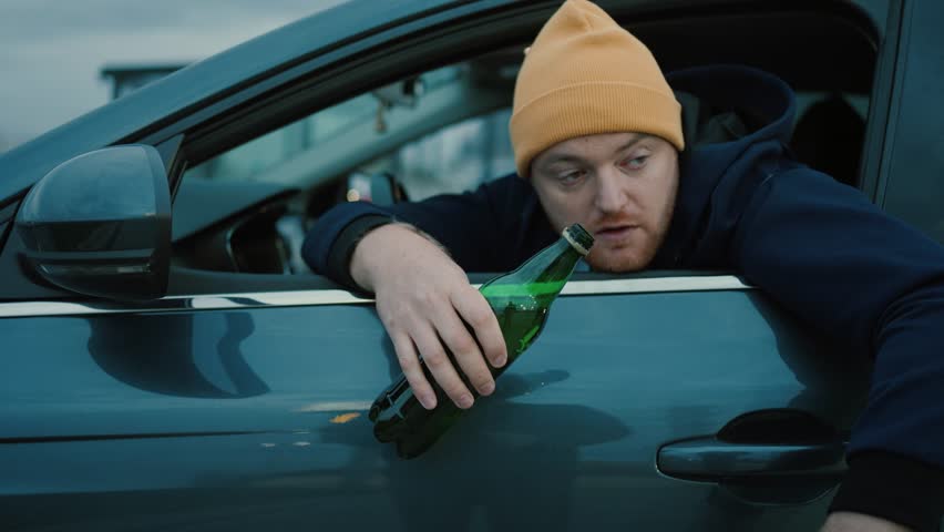 Drunken Driving Risk Car Accident.Man Holding Alcohol Bottle In Car. Dangerous On Road Drunk Driving.Stress Unlawful Intoxicated Drive Auto.Drunk Driving Sitting On Car.Tired Man Illegal Vehicle Drive Royalty-Free Stock Footage #1111582291