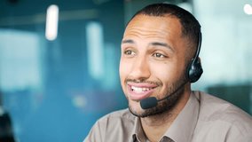 Close up. A corporate operator who works in customer support speaks on a video call using a laptop. Call center agent in wireless headset helping customer with complaints in office Online consultation - Powered by Shutterstock - Get 15% off with code: PIKWIZARD15