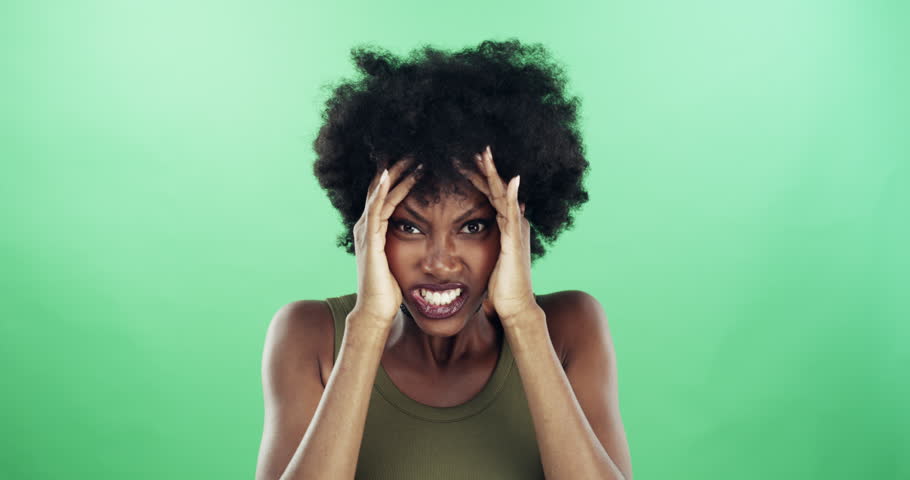 Green screen, woman and angry in portrait, mad and upset for mistake, fail and announcement. Black female person, stress and frustrated in mockup, studio and bipolar or ptsd, crisis and psychology | Shutterstock HD Video #1111585649
