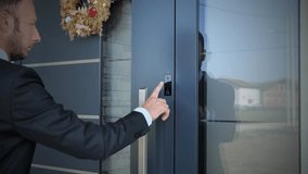 Business man using fingerprint to unlock smart key home entrance, future concept - Powered by Shutterstock - Get 15% off with code: PIKWIZARD15