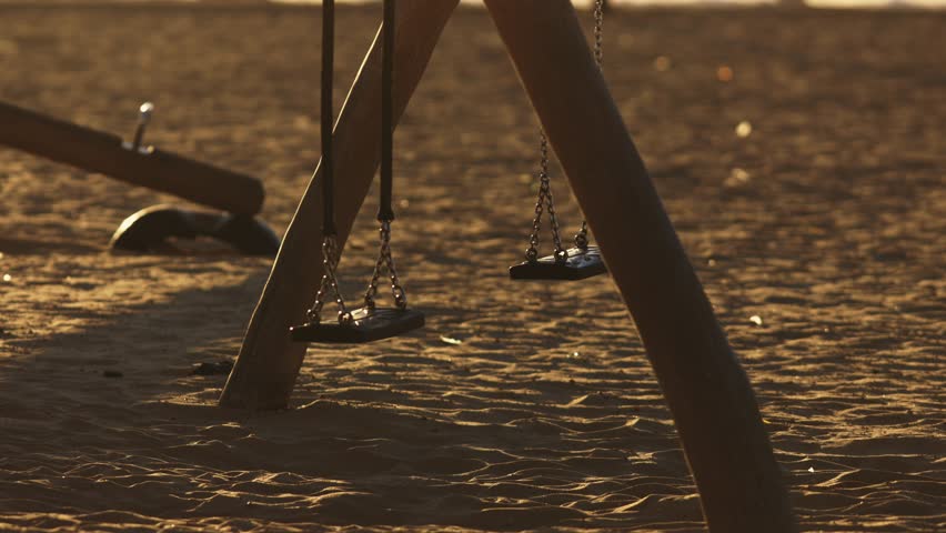 Empty swing set for child in the sand Royalty-Free Stock Footage #1111587241