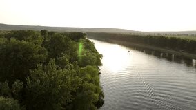 Aerial footage of Dnister river at sunset. Bird's eye view. Location place Dniester River, Moldova, Europe. Cinematic drone shot. Filmed in 4k video. Discover the beauty of earth.