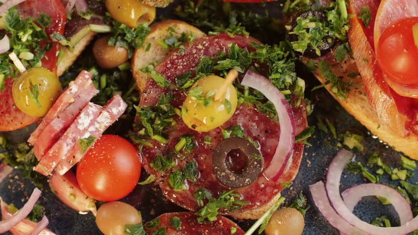 Tapas, Mix of spanish pork sausages, Cutting board of appetizing catalonian snack - fuet, jamon, chorizo, olives, supermarket tapas food in spain, traditional cuisine.  | Shutterstock HD Video #1111589815