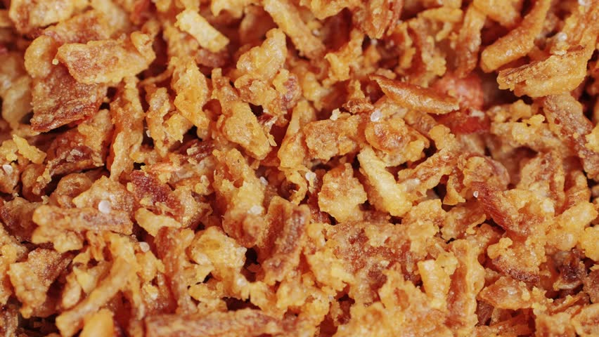 Traditional fried crispy onions backed in flour close-up macro. Dried onion topping. Fast food. Snacks | Shutterstock HD Video #1111589855