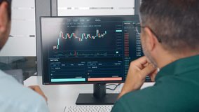 Financial advisor consulting investor discussing financial trading data. Two stock traders analysing crypto market investment strategy doing digital online finance forecast at meeting. Close up screen - Powered by Shutterstock - Get 15% off with code: PIKWIZARD15