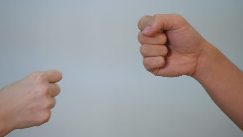 Greetings with elbows and fists for a safe handshake. People's hands close up on camera, greeting with elbows, safety fists to avoid illness. avoid infection through people's hands Royalty-Free Stock Footage #1111595509